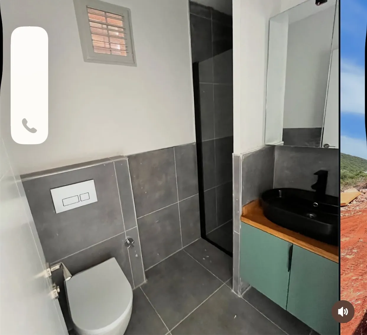 40ft container home tiled bathroom with enclosed shower and vanity