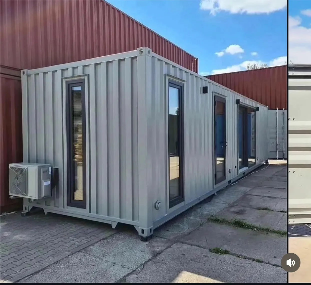40ft container home exterior corner with double-pane windows and wall-mount A/C