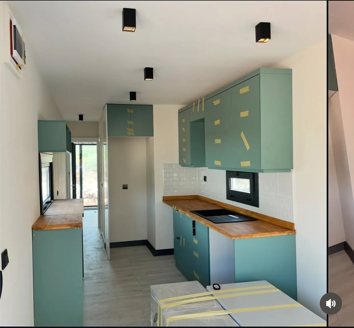 40ft container home galley kitchen with subway tile backsplash