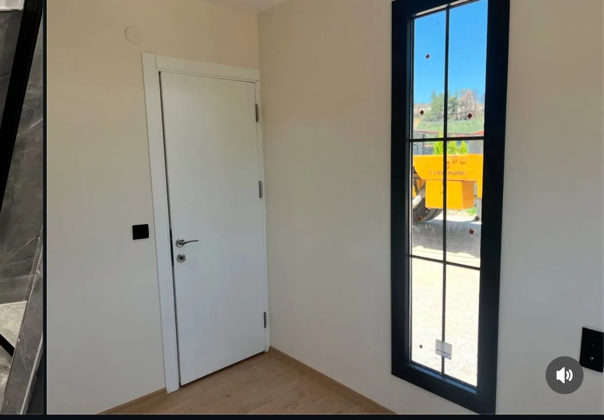 40ft container home interior room with door and black-frame window