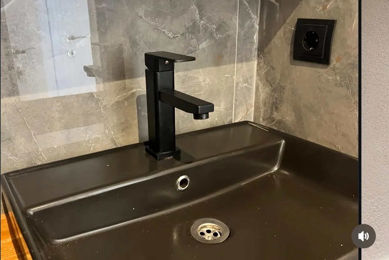 40ft container home bathroom vanity with black fixtures